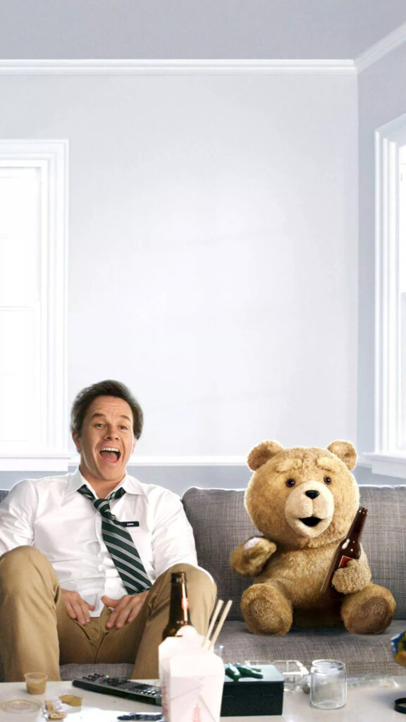 Mark Wahlberg and Ted Relaxing on Sofa Mobile Wallpaper