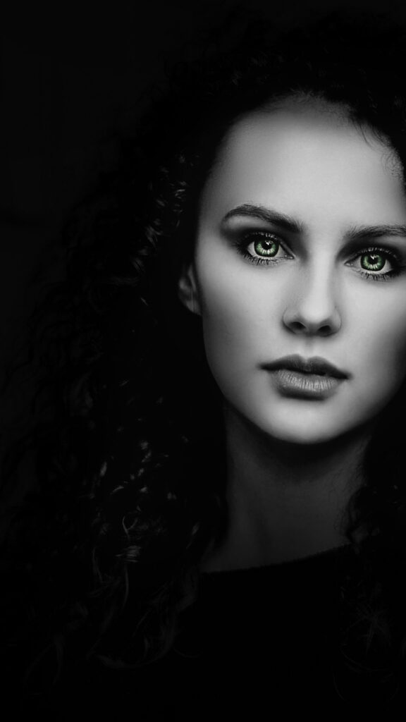 Stunning Portrait of a Woman with Green Eyes Mobile Wallpaper