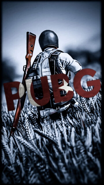 Soldier with Rifle in Grassy Field Mobile Wallpaper