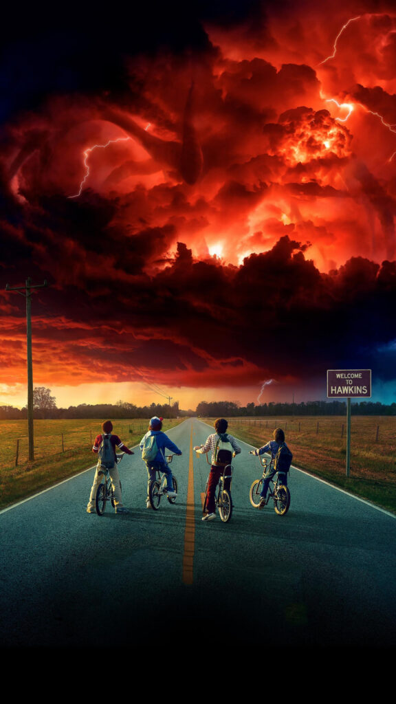 Four Kids Cycling Toward a Stormy Red Sky Mobile Wallpaper