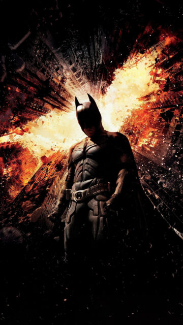 The Dark Knight Rises Batman Standing Against Exploding City Mobile Wallpaper