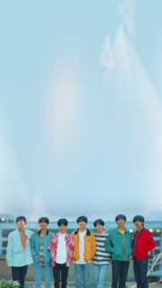 BTS Group Portrait Standing Against a Bright Sky Mobile Wallpaper