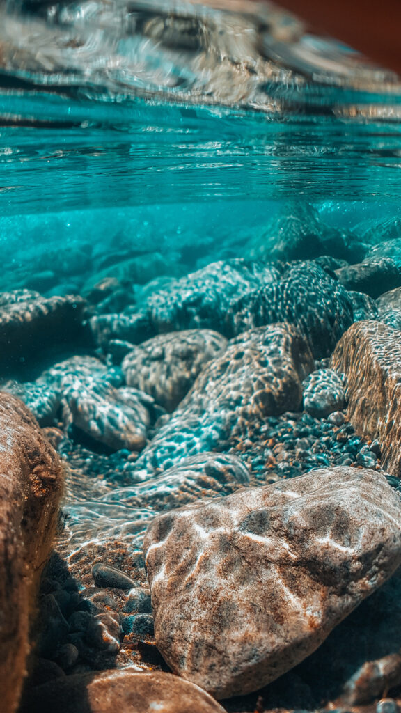 Crystal Clear Underwater Stones Mobile Wallpaper