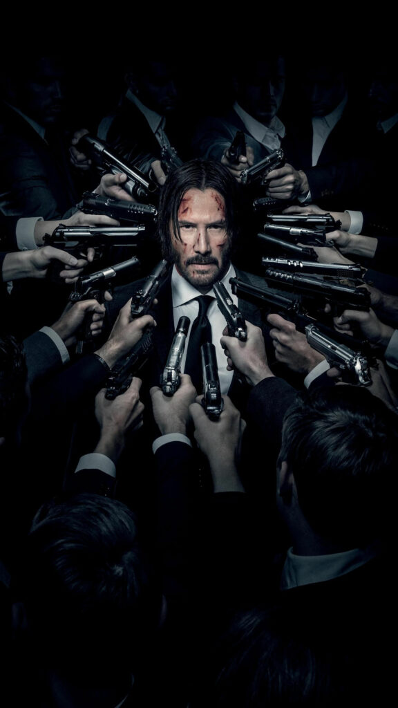 John Wick Surrounded by Guns Mobile Wallpaper