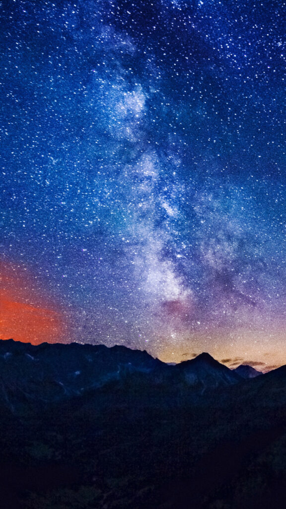 Celestial Milky Way and Starlit Mountain Peak Spiritual Energy Wallpaper