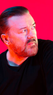 Ricky Gervais Vibrant Red Lighting Portrait Mobile Wallpaper