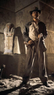 Indiana Jones Standing in Ancient Tomb Mobile Wallpaper