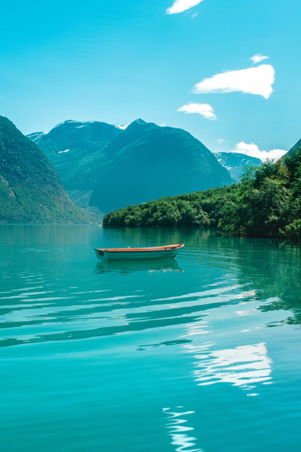 Serene Turquoise Fjord with a Lonely Boat Mobile Wallpaper