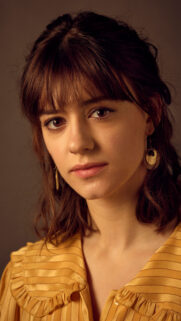 Portrait of Daisy Edgar-Jones in Yellow Blouse Mobile Wallpaper