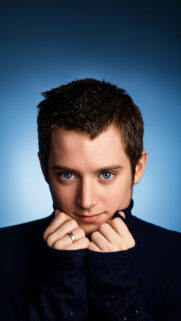 Elijah Wood Blue Background Portrait Mobile Wallpaper