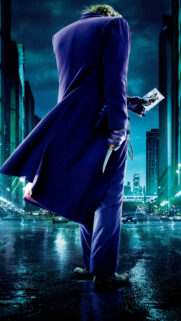 The Dark Knight Joker Standing in Gotham City Mobile Wallpaper