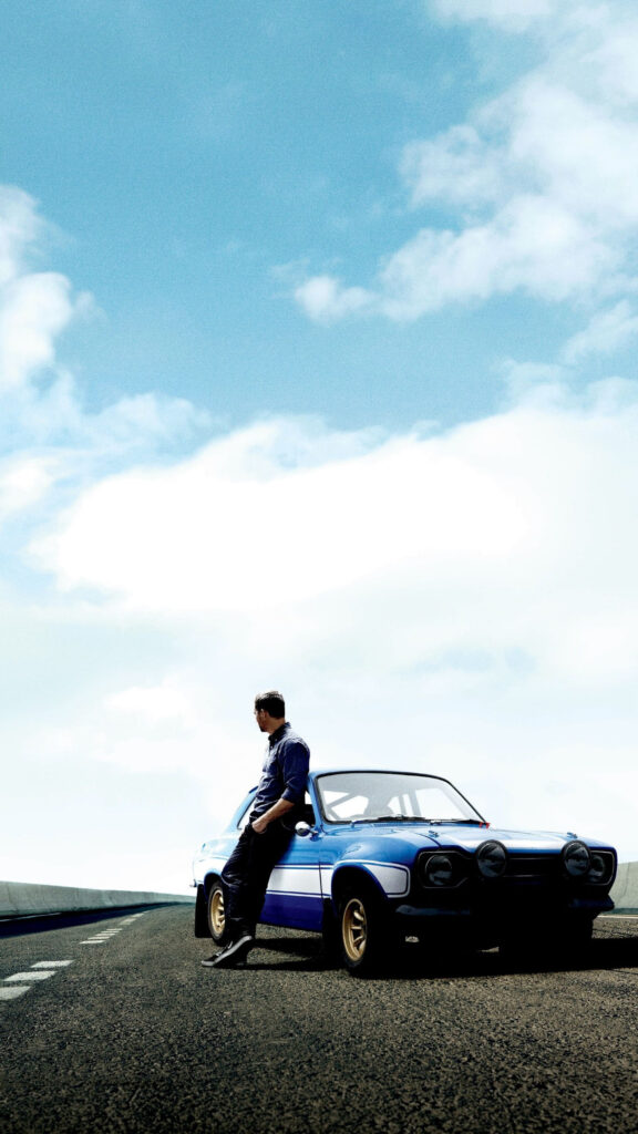 Paul Walker Leaning on a Ford Escort Mobile Wallpaper