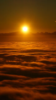 Breathtaking Golden Sunrise Above the Clouds Mobile Wallpaper