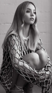 Stunning Blonde Woman in Metallic Mesh Dress Mobile Wallpaper