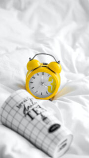 Yellow Alarm Clock and Tea Mug Mobile Wallpaper