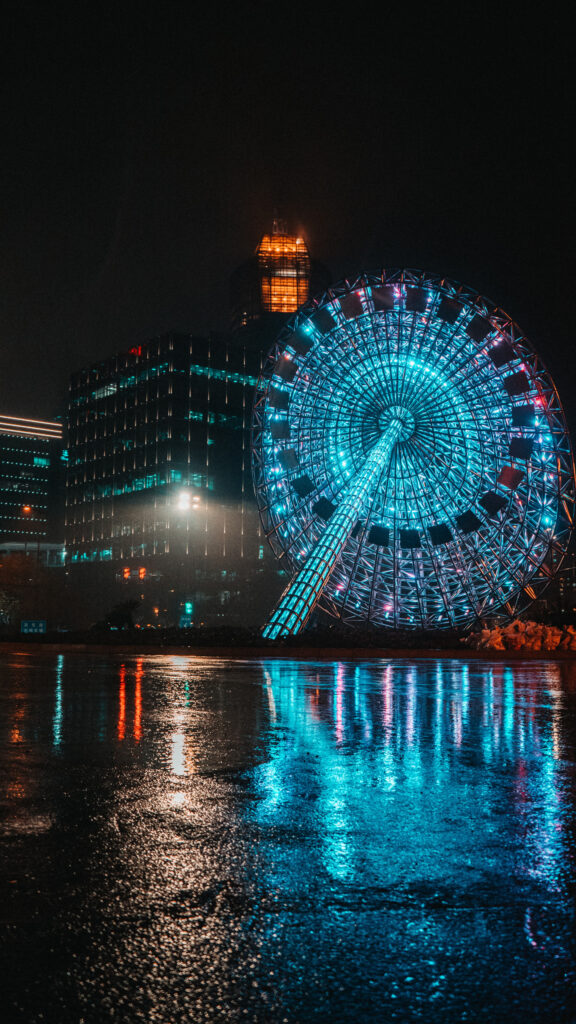 Stunning Neon Illuminated Ferris Wheel Night Reflection Mobile Wallpaper