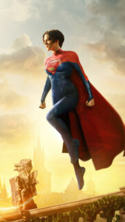 Sasha Calle Supergirl Flying over Gothic Architecture Mobile Wallpaper