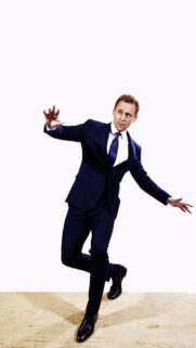 Tom Hiddleston Elegant Suit Pose Mobile Wallpaper