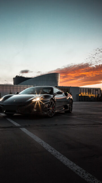 Stunning Black Ferrari at Golden Hour Mobile Wallpaper