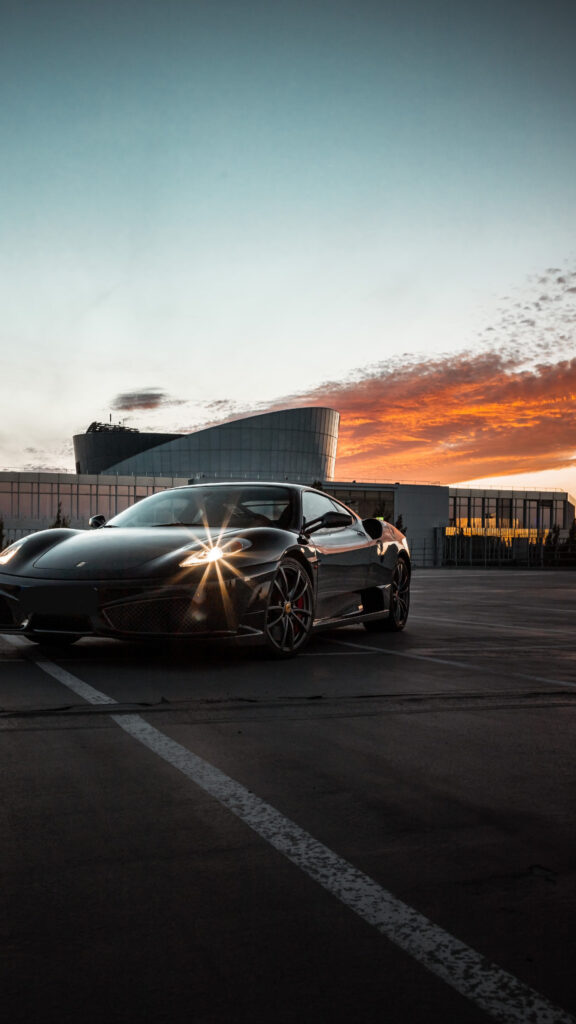 Stunning Black Ferrari at Golden Hour Mobile Wallpaper
