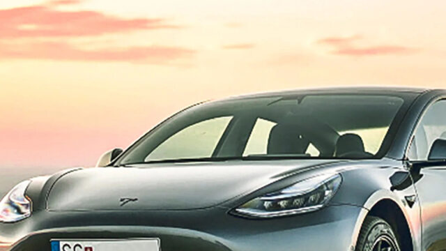 Sleek Tesla Model 3 at Sunset Mobile Wallpaper