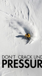Skier Carving Down Powder Snow Mobile Wallpaper