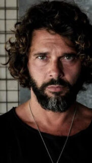 Portrait of a Bearded Man with Curly Hair Mobile Wallpaper