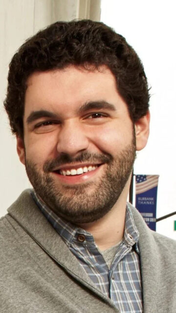 Portrait of a Smiling Man in Plaid Shirt Mobile Wallpaper