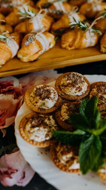 Gourmet Dessert Pastries and Croissants Table Feast Wallpaper