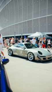 Custom Modified Silver Porsche 911 Sportscar at Outdoor Car Show Wallpaper