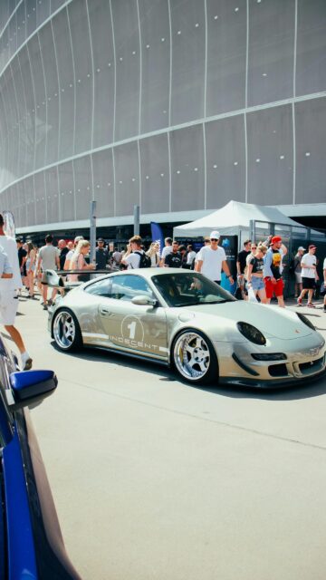 Custom Modified Silver Porsche 911 Sportscar at Outdoor Car Show Wallpaper