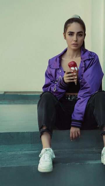 Stylish Girl in Purple Jacket Eating Ice Cream Mobile Wallpaper