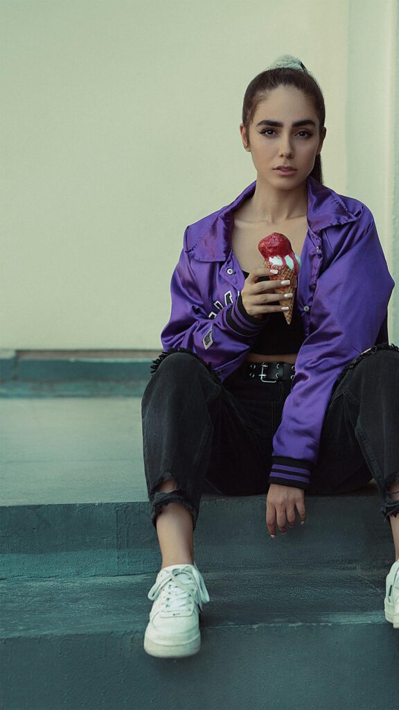 Stylish Girl in Purple Jacket Eating Ice Cream Mobile Wallpaper