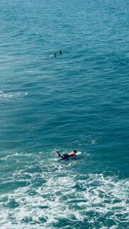 Surfer Riding Ocean Waves Aerial View High Quality Mobile Wallpaper