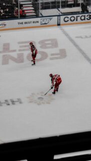Dynamic Ice Hockey Player Action Shot Mobile Wallpaper
