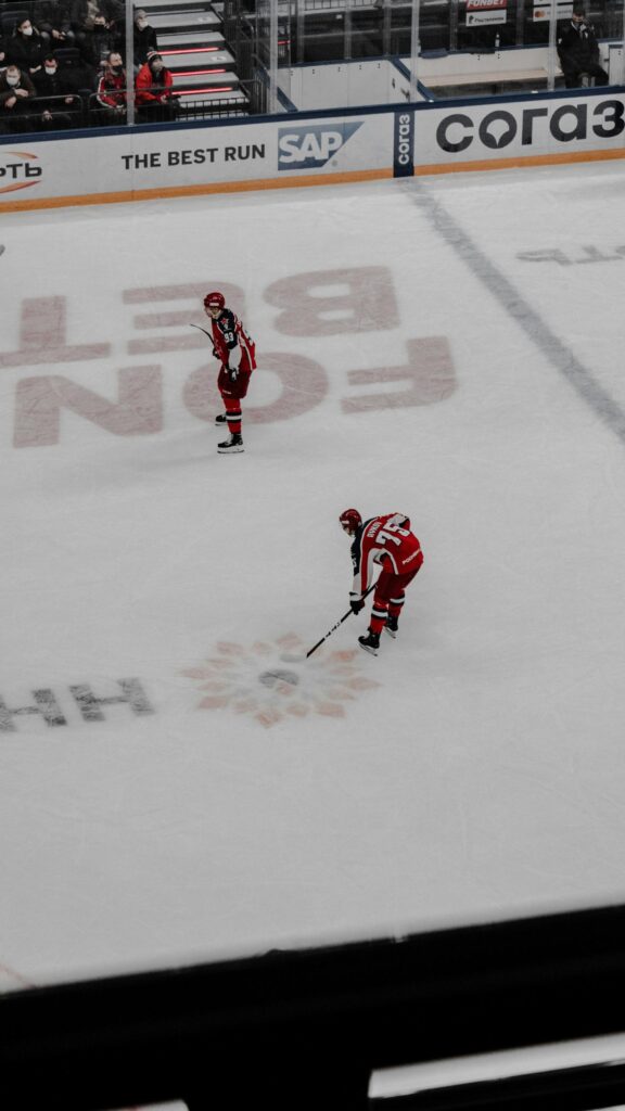 Dynamic Ice Hockey Player Action Shot Mobile Wallpaper