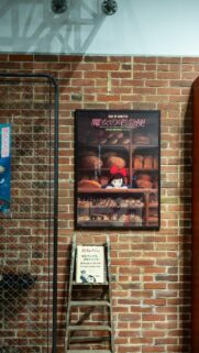 Kiki’s Delivery Service Poster on Brick Wall Cinematic Wallpaper