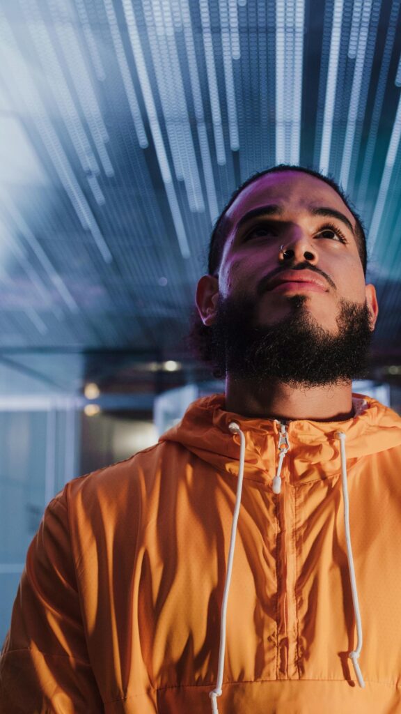 Portrait of a Bearded Man in Orange Hoodie Cinematic Phone Wallpaper