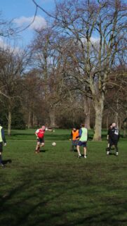 Amateur Football Match in the Park Action Shot Mobile Wallpaper