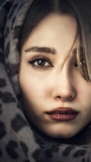 Stunning Portrait of a Woman with Leopard Print Hood Mobile Wallpaper