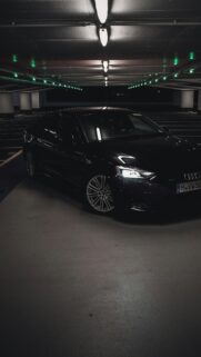 Sleek Black Audi A5 Luxury Car in Dark Parking Garage Wallpaper