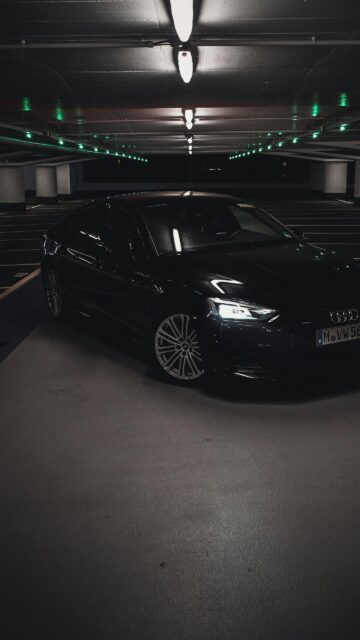 Sleek Black Audi A5 Luxury Car in Dark Parking Garage Wallpaper