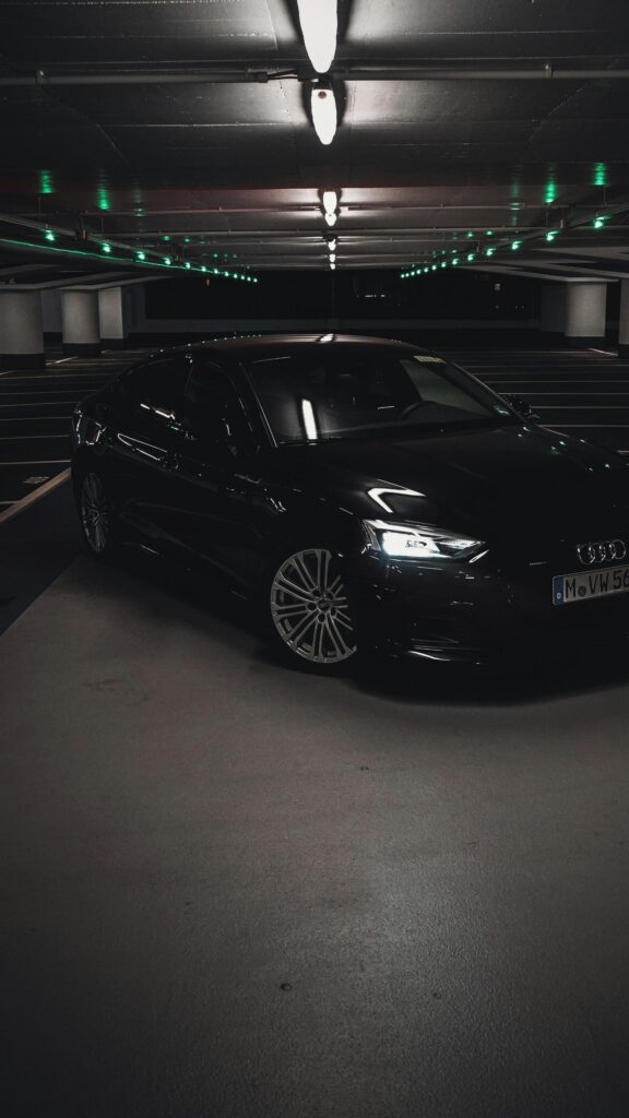 Sleek Black Audi A5 Luxury Car in Dark Parking Garage Wallpaper
