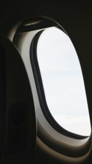 Minimalist Airplane Window View Above The Clouds 4K Mobile Wallpaper