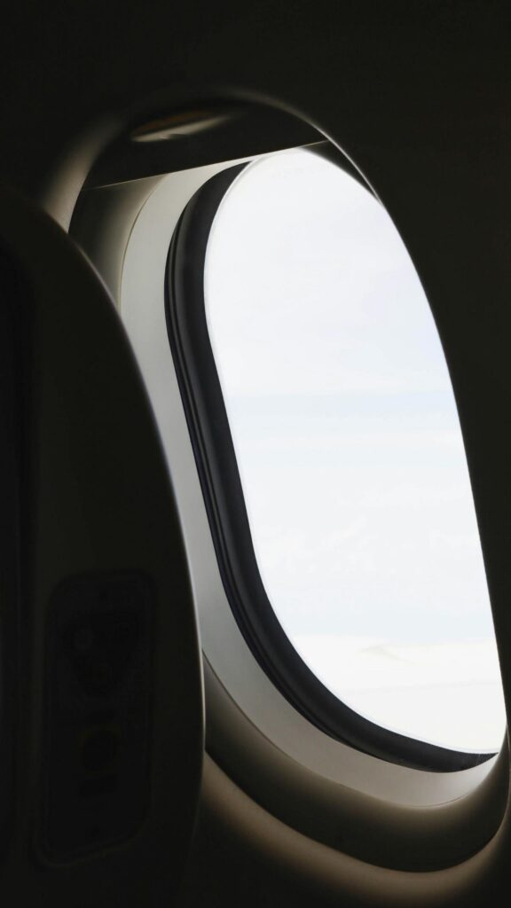Minimalist Airplane Window View Above The Clouds 4K Mobile Wallpaper