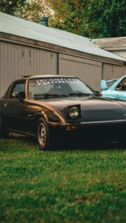 Classic Black Mazda RX-7 Vintage Sportscar Aesthetic Mobile Wallpaper