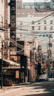 Stunning Japanese Urban Streetscape with Wires and Sports Car Wallpaper