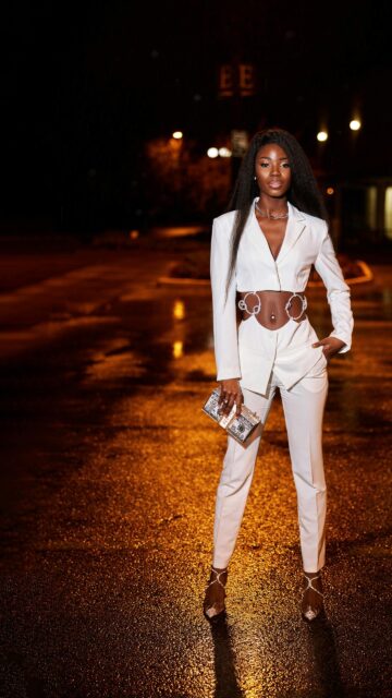 Elegant Black Model in White Cutout Suit Night Street Wallpaper