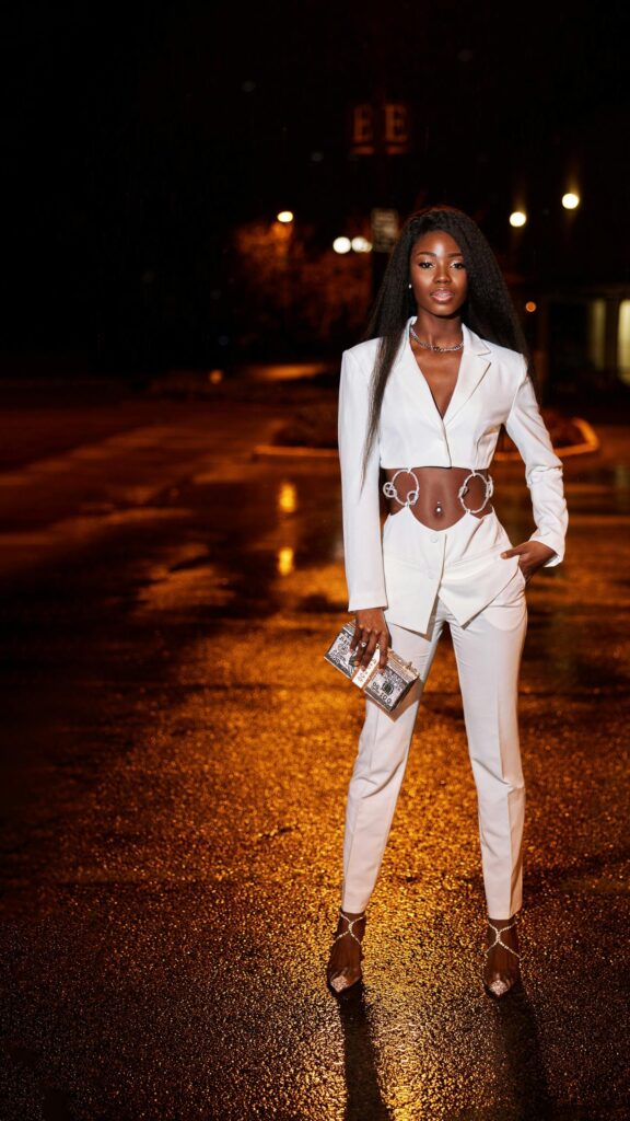 Elegant Black Model in White Cutout Suit Night Street Wallpaper