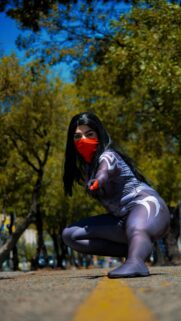 Spider-Man Cosplay Heroine Crouching on Road Mobile Wallpaper